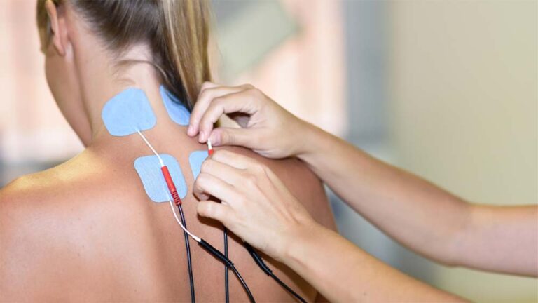 woman receiving electrical therapy